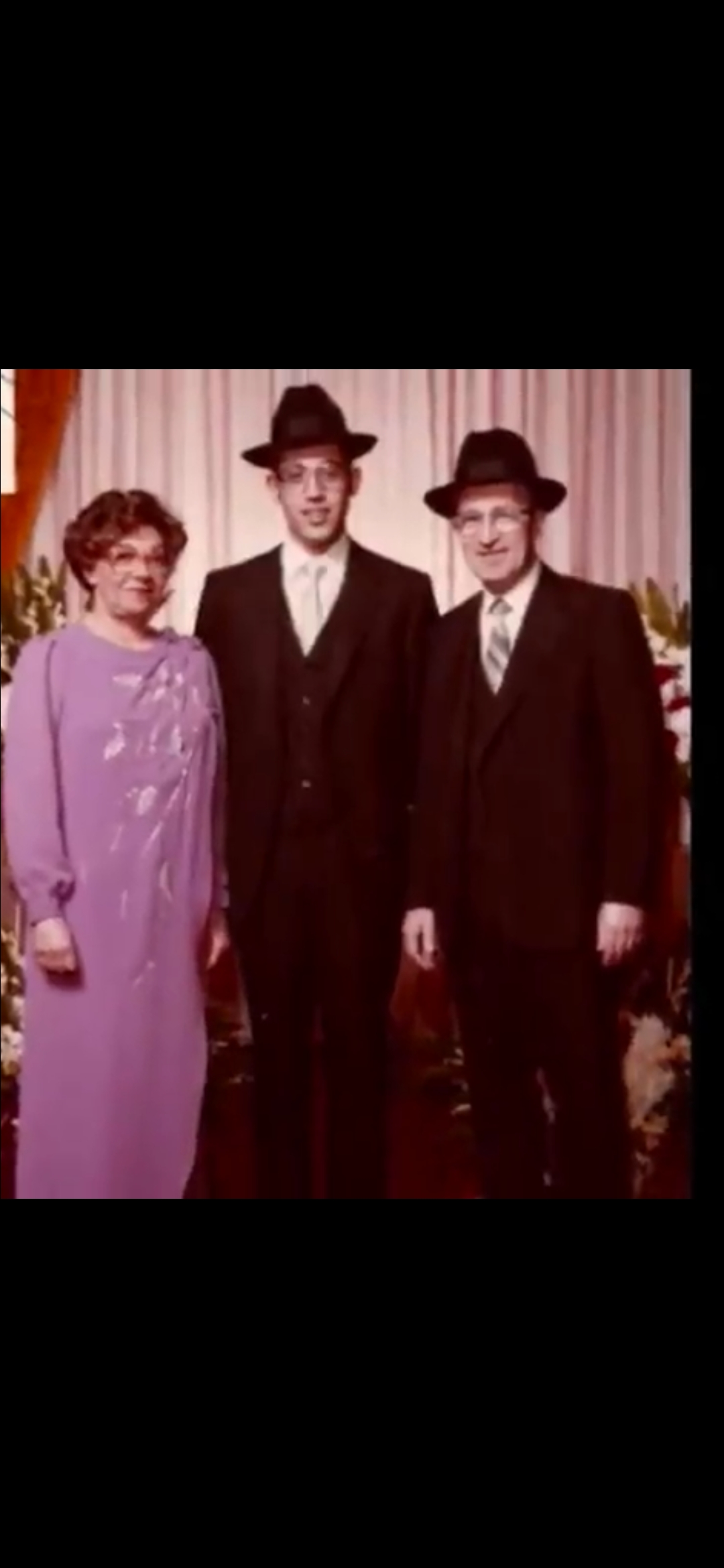 Tatty (Menachem) flanked by his parents Bobby and Zeidy on his wedding day.